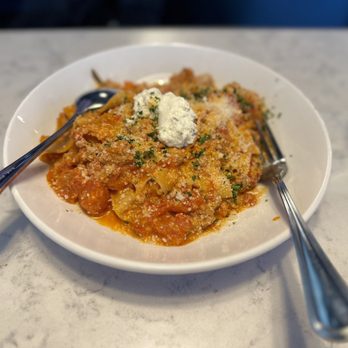 It’s A Utica Thing Kitchen and Bar signature dishes Chicken RiggiesUtica GreensSausage RiggiesBrisket Arancini